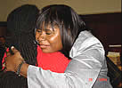 Debra Hall-Martin hugs graduate